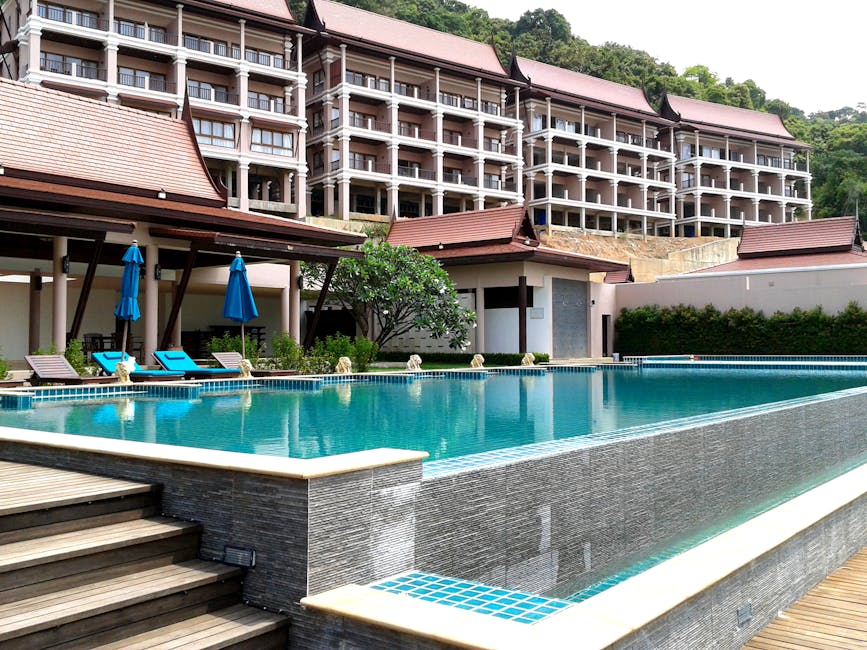 Relaxing tropical resort with a pristine pool and modern architecture, perfect for a summer getaway