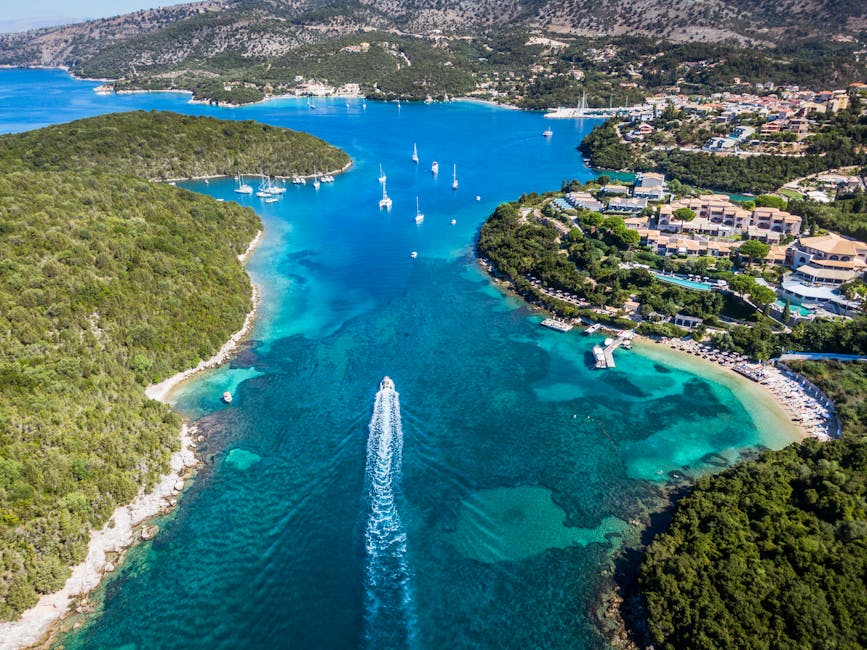 Explore the stunning aerial view of Syvota's emerald coast, with vibrant blue waters and lush landscapes